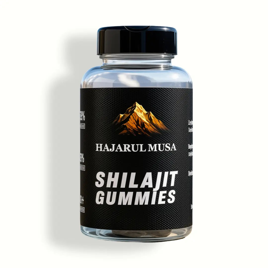 A bottle of Hajarul Musa Shilajit Gummies with a black cap and a black label featuring a gold mountain logo, set against a pale beige background with a soft shadow.
